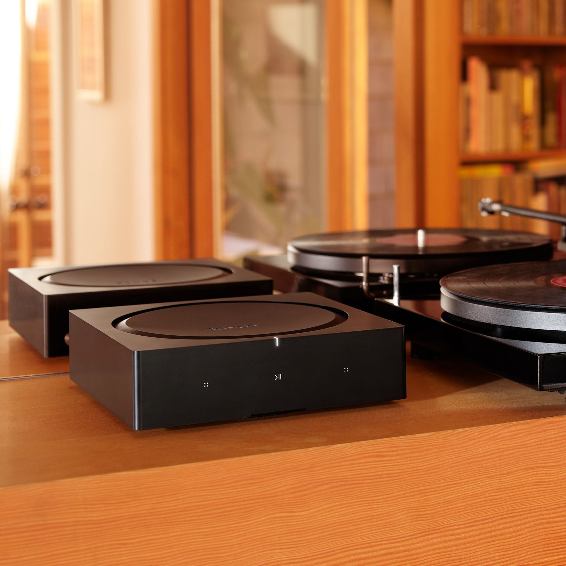 Lifestyle Image of a Sonos Amp in Black.