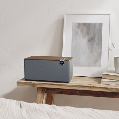 Lifestyle Image of the Klipsch Three Plus Bluetooth Speaker in Walnut