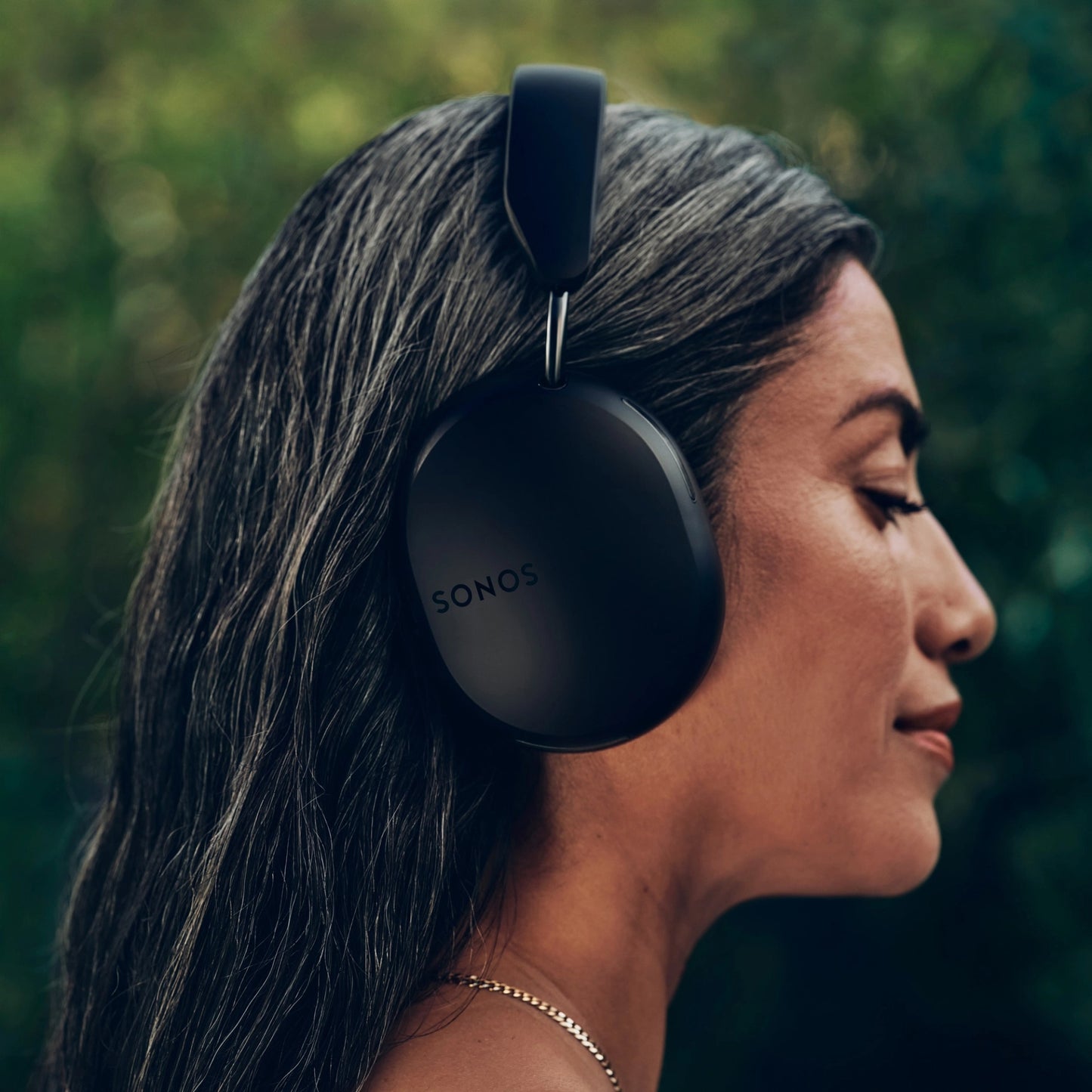 Lifestyle image of Sonos Ace Headphones in black.