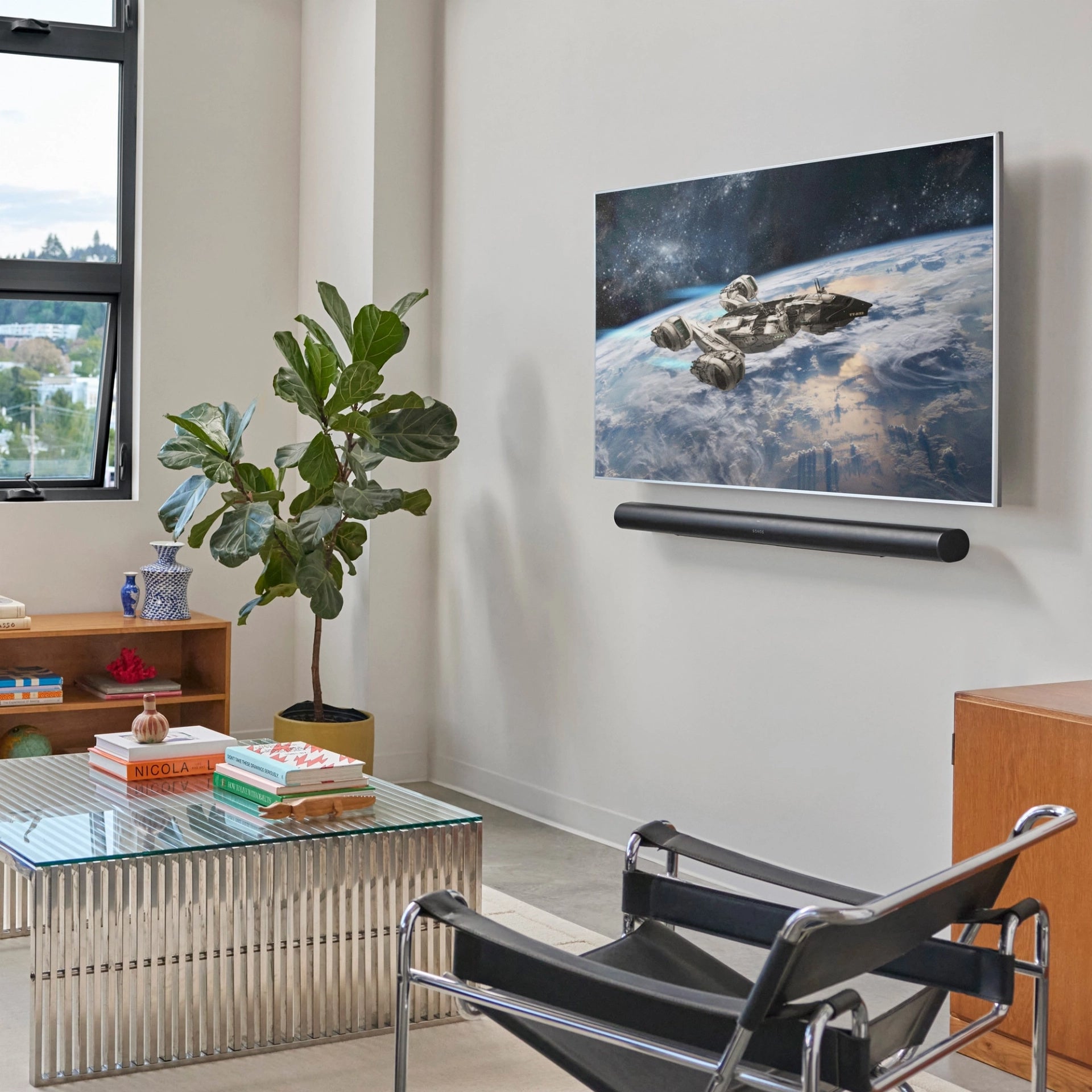 Lifestyle image for a Sonos Arc Ultra soundbar in black.